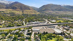 Aerial perspective of suburban area featuring a mountain backdrop