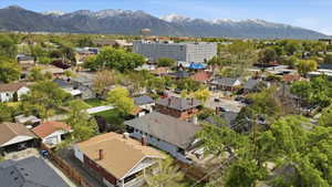 Aerial perspective of suburban area with a mountainous background