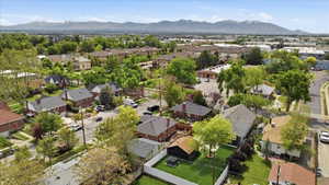 Aerial perspective of suburban area featuring a mountainous background