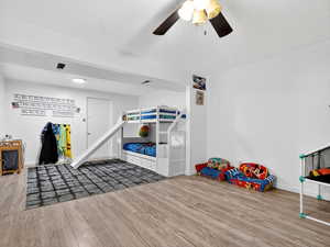 Game room featuring wood finished floors and ceiling fan