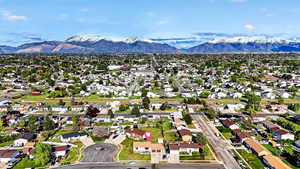 Aerial perspective of suburban area featuring a mountainous background