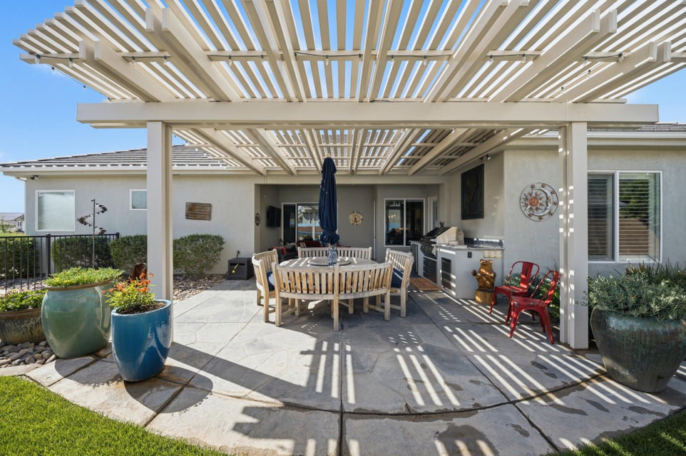 View of patio / terrace featuring a pergola and an outdoor kitchen / dining area