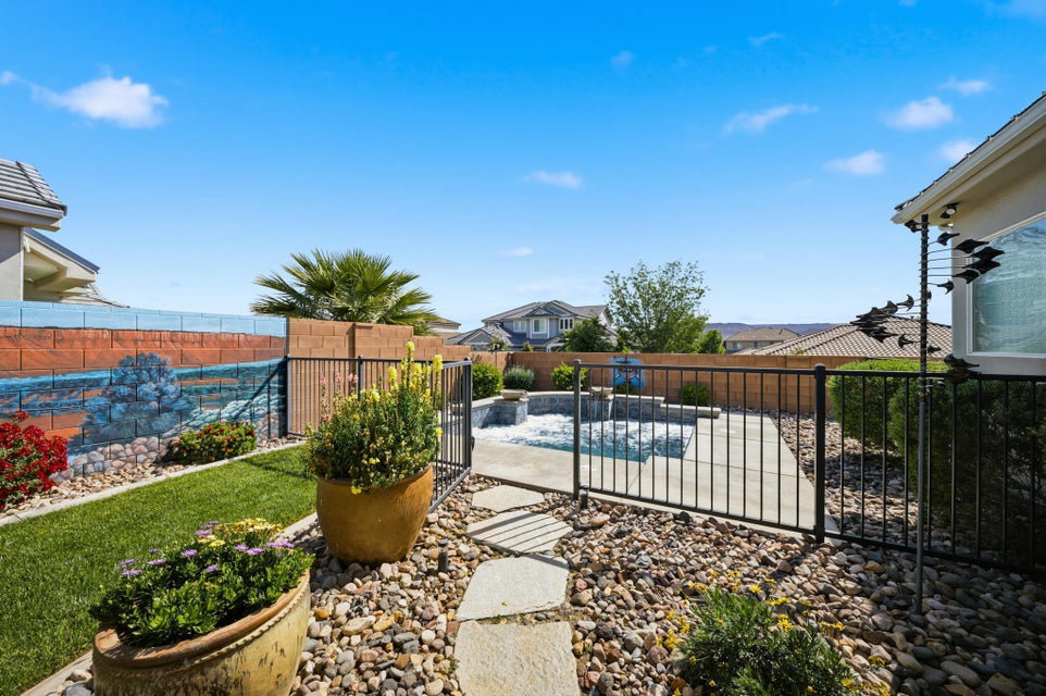 View of pool with patio surround and a fenced backyard