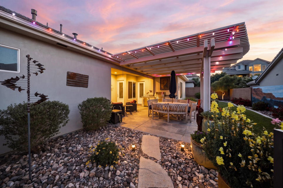 Patio terrace at dusk with outdoor dining space, a patio, and a pergola