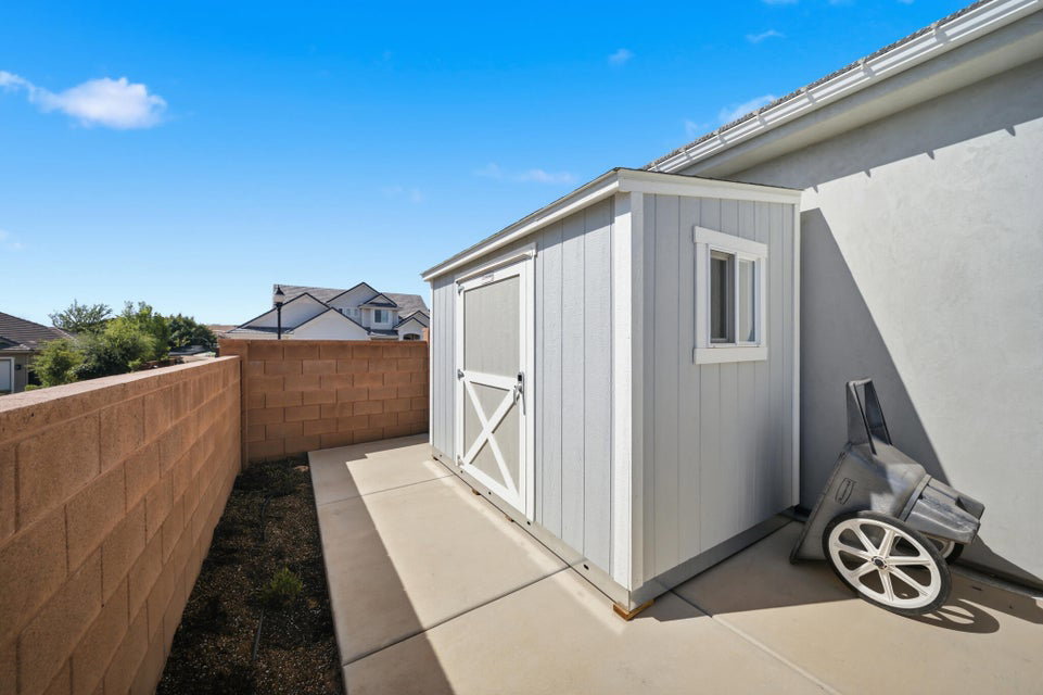View of shed featuring a fenced backyard