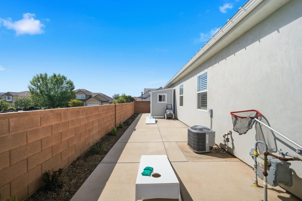 Fenced backyard with a patio