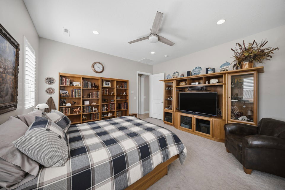 Bedroom featuring a ceiling fan, light colored carpet, and recessed lighting