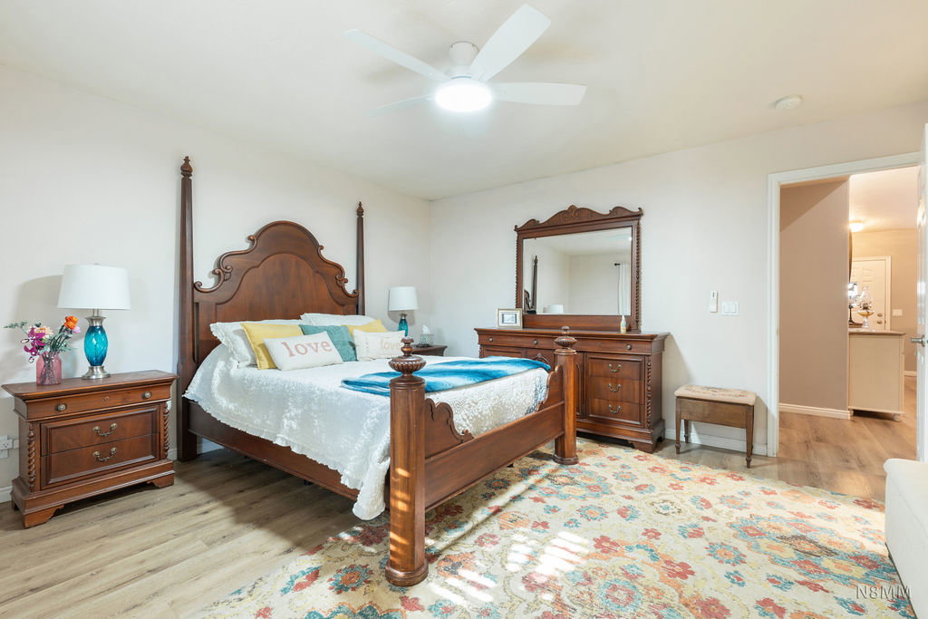 Bedroom with light wood-style flooring and ceiling fan