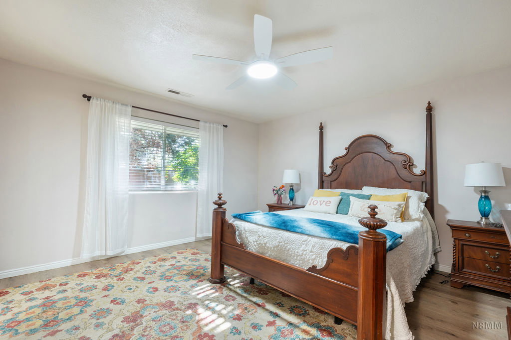 Bedroom featuring ceiling fan and light wood-style flooring