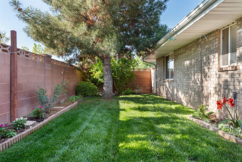 View of fenced backyard