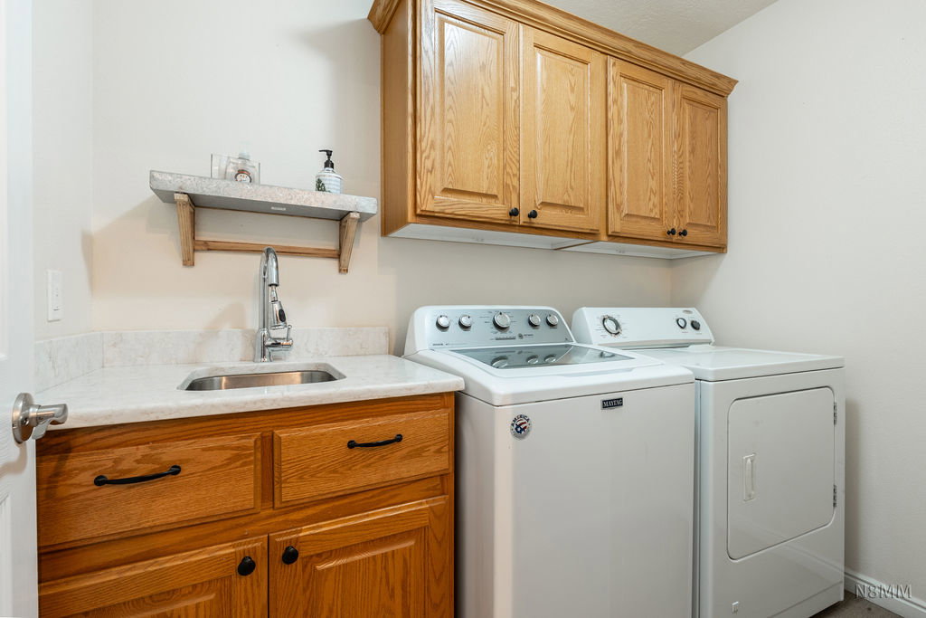 Laundry room featuring cabinet space and washing machine and dryer