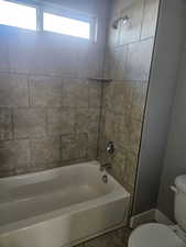 Bathroom with shower / bath combination and tile patterned floors