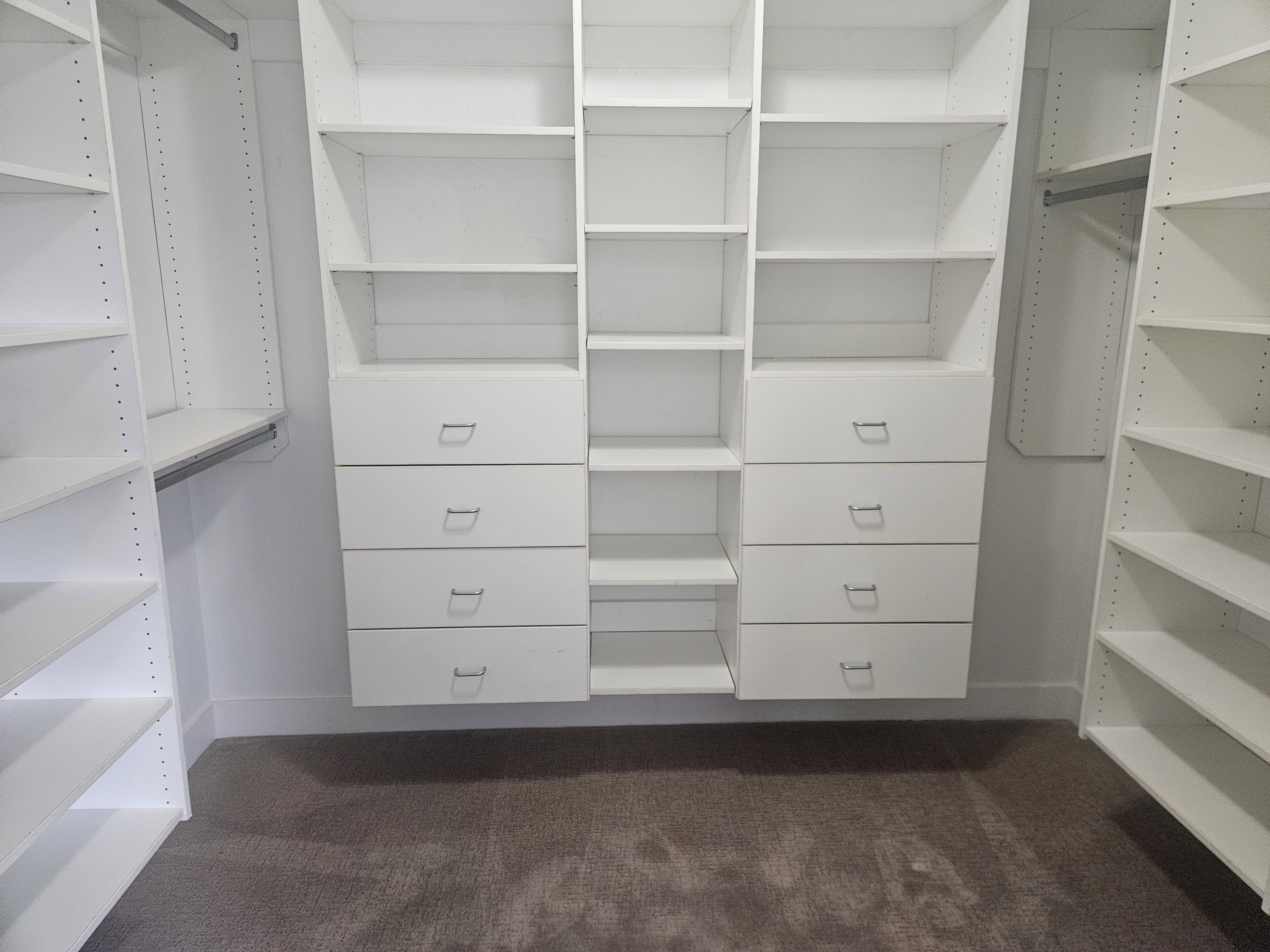 Walk in closet featuring dark carpet