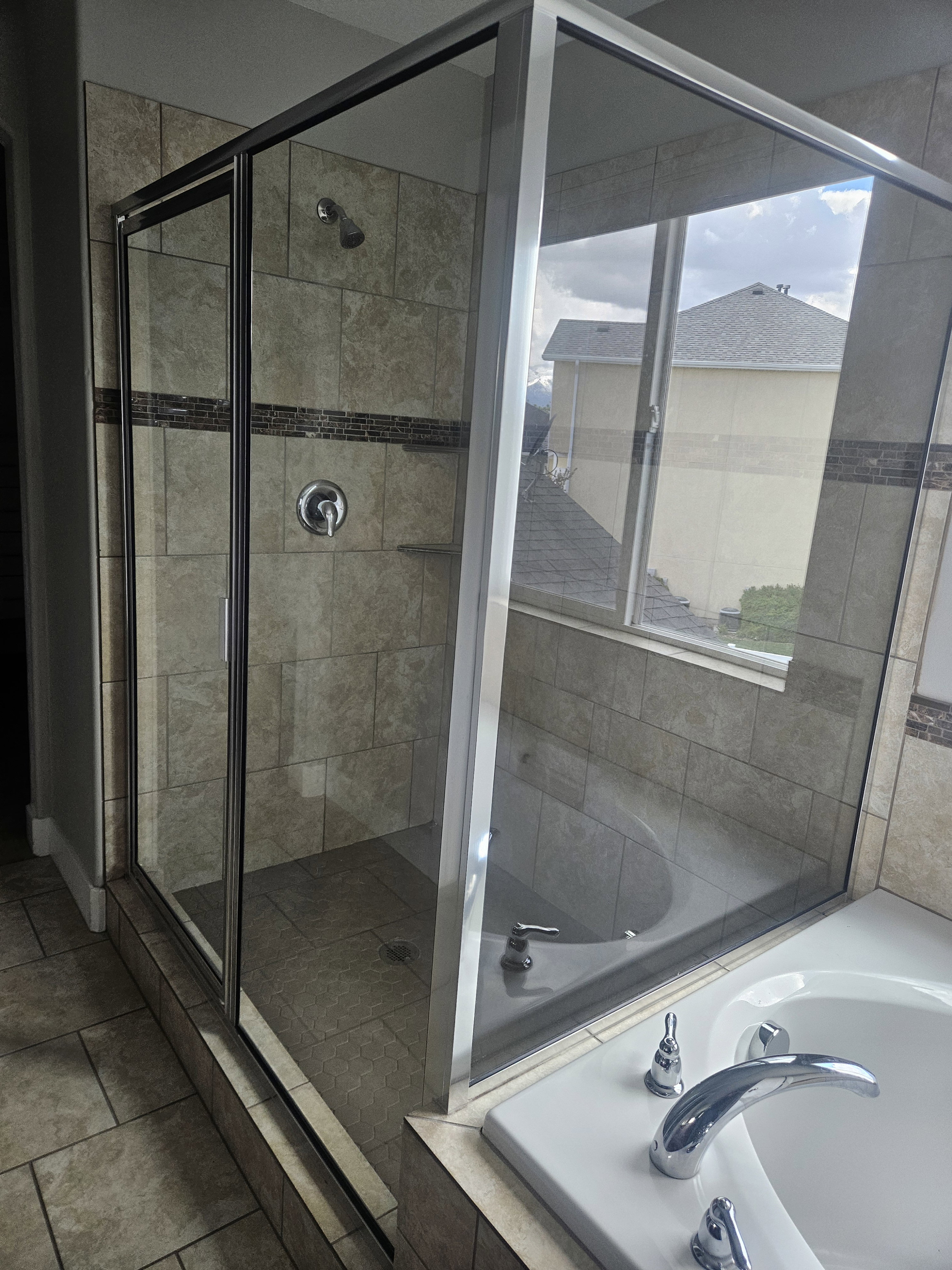 Full bathroom featuring a stall shower and a bath