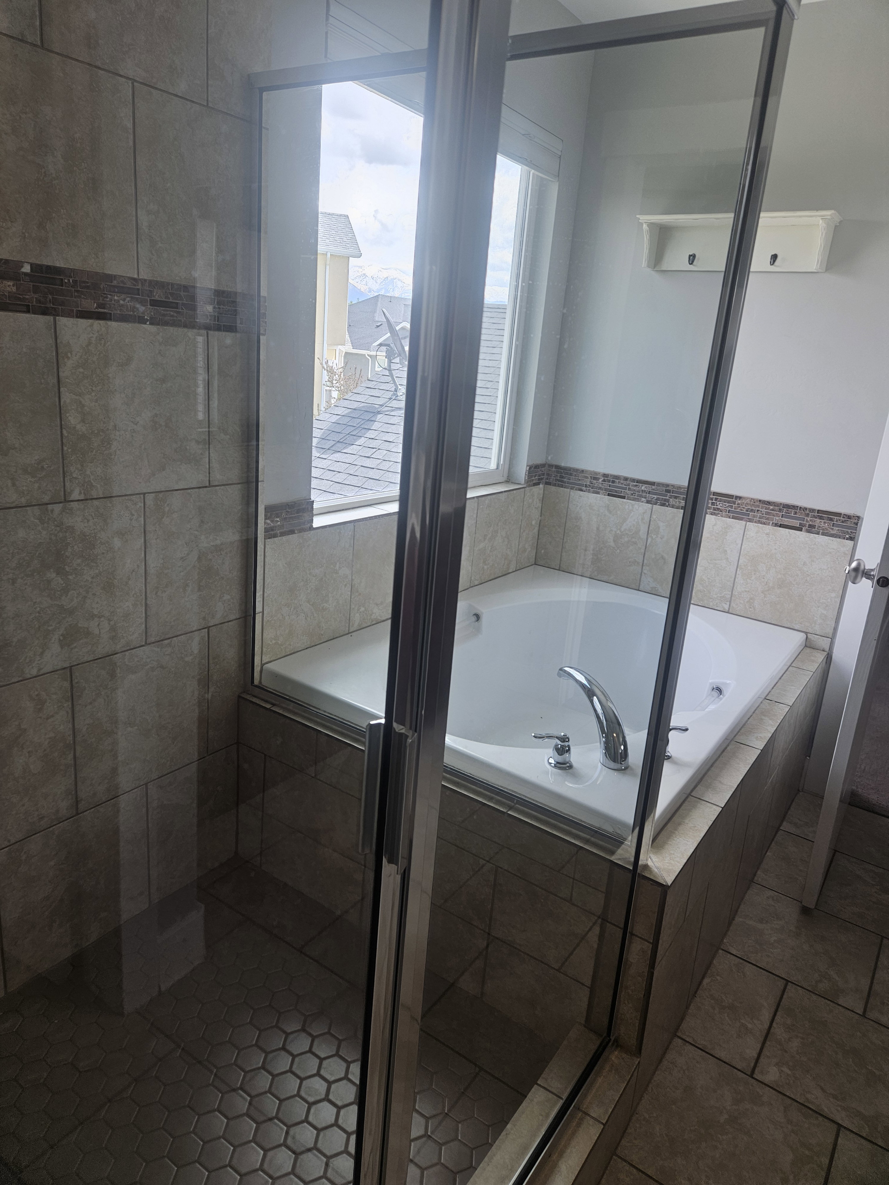 Full bathroom with a garden tub, a stall shower, and tile patterned floors