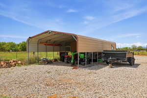 View of outdoor structure featuring a carport
