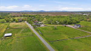 Overview of rural landscape with a mountain backdrop