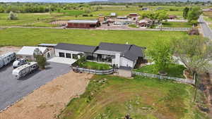 Aerial view of sparsely populated area featuring a pastoral area
