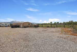View of yard with a mountain view and a rural view