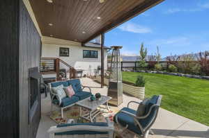 View of patio featuring an outdoor living space and a mountain view