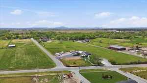 Overview of rural landscape featuring a mountainous background