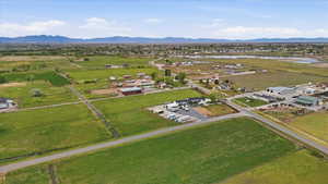 Aerial view of property's location featuring a water and mountain view and rural landscape