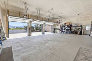 Garage featuring a mountain view and a garage door opener