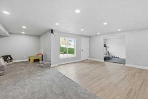 Unfurnished room with light wood-type flooring and recessed lighting