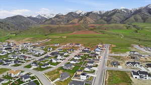 Aerial view of residential area featuring a mountainous background