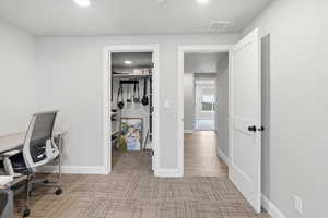 Home office with baseboards and recessed lighting