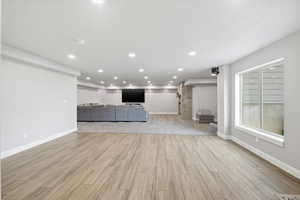 Unfurnished living room with light wood-style floors and recessed lighting