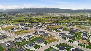Aerial view of residential area featuring a mountainous background