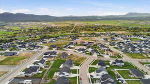 Aerial perspective of suburban area with a mountain backdrop