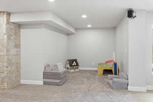 Sitting room featuring carpet flooring and recessed lighting