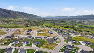 Aerial perspective of suburban area with a mountain backdrop