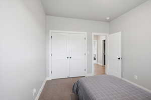 Bedroom with carpet flooring and a closet
