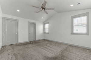 Unfurnished bedroom with carpet floors, recessed lighting, lofted ceiling, and ceiling fan