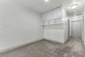 Unfurnished room featuring baseboards and carpet floors