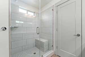 Bathroom featuring a shower stall
