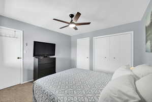 Upstairs bedroom with closet and door to the 3rd bedroom* lofted space with pony wall.