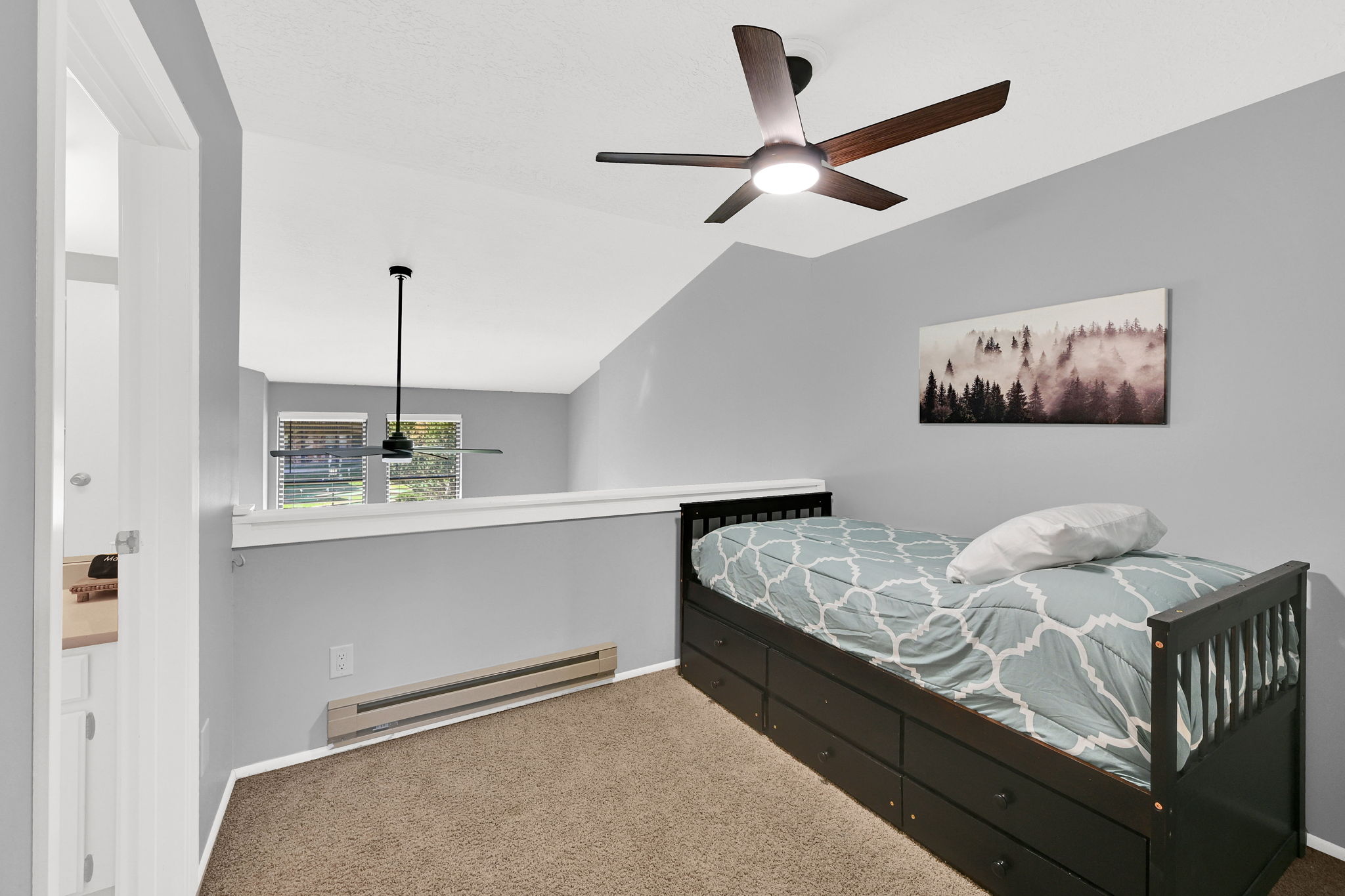3rd bedroom* in lofted space with trundle bed and direct bathroom access.
