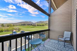 Balcony featuring a mountain view and golf course view