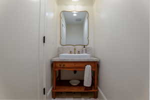 Bathroom with vanity and baseboards