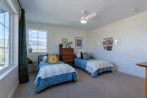 Bedroom featuring carpet and a ceiling fan