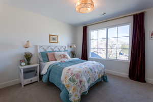 Carpeted bedroom with baseboards