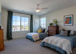 Bedroom featuring carpet and ceiling fan