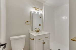 Bathroom featuring vanity and a walk in shower