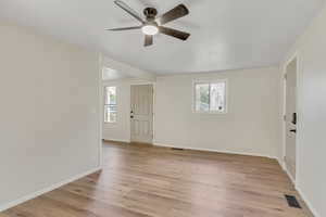 Spare room with light wood-type flooring and a ceiling fan