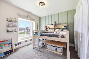 Bedroom featuring light colored carpet