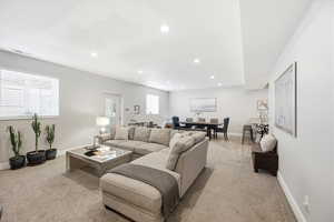 Living room featuring light carpet and recessed lighting